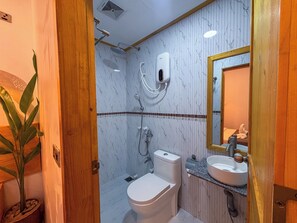 A bathroom with a toilet, sink, and shower. - Eco Palm Maldives (Mathiveri)