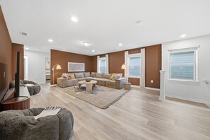 Large windows in the second floor living room - 7BD Luxury Villa w/ Pool, Ping-Pong & BBQ - Windsor Resort Access (Kissimmee)
