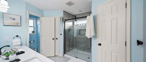 Shower, hair dryer, towels, soap