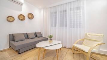 Appartement Confort | Coin séjour | Télévision à écran plat