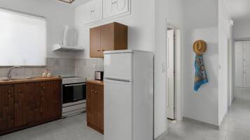 Family Apartment | Private kitchen | Fridge, oven, stovetop, electric kettle