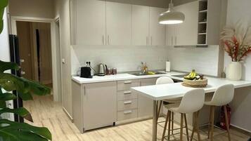 Comfort Apartment | Living area | Flat-screen TV