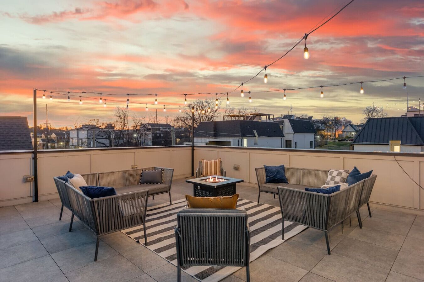 Spacious, private rooftop patio with hanging lights, a fire pit and plenty of seating. Perfect for relaxing with your group and enjoying an incredible view of the city!