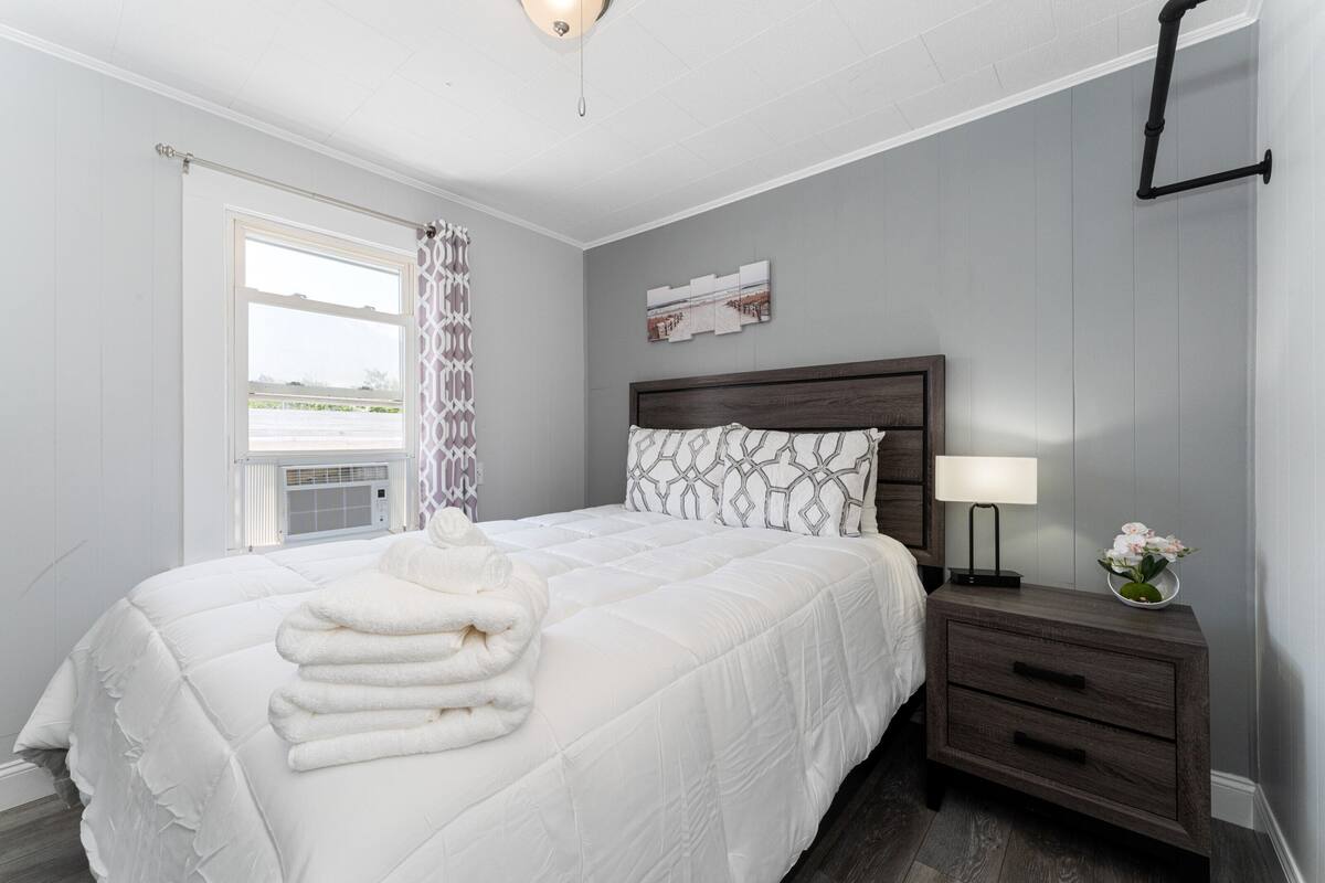 Desk, laptop workspace, blackout curtains, iron/ironing board