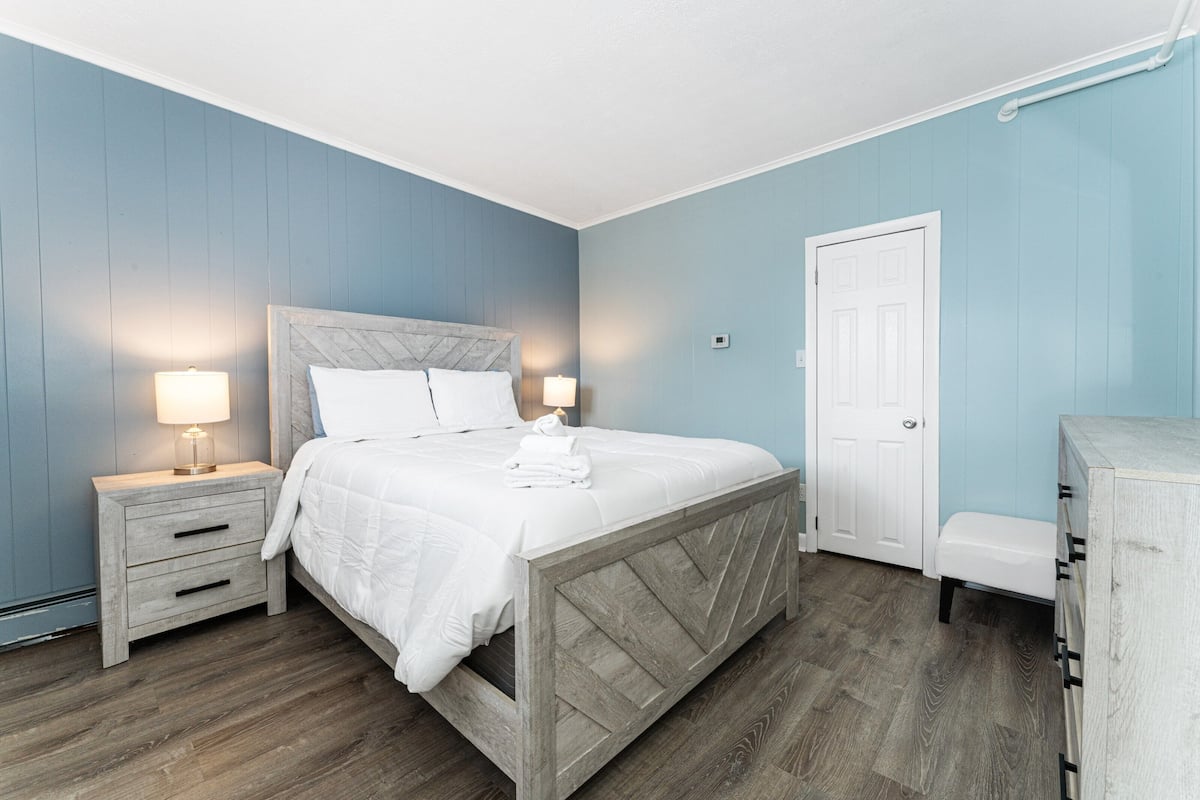 Desk, laptop workspace, blackout curtains, iron/ironing board