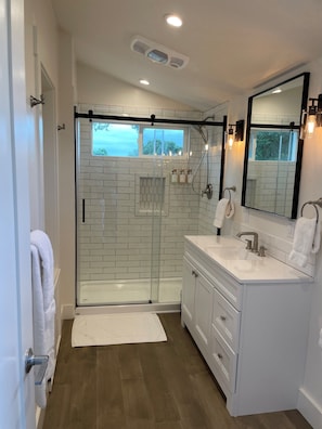 Shower, hair dryer, towels, soap