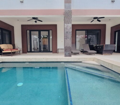 Spacious bedrooms, pool, foosball and Picketball. Near the beach