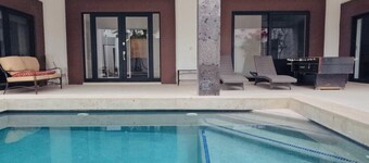 Spacious bedrooms, pool, foosball and Picketball. Near the beach