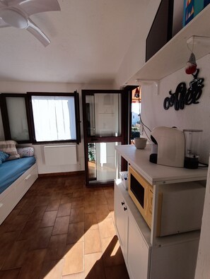 Fridge, microwave, stovetop, coffee/tea maker