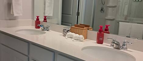 Shower, hair dryer, towels, soap
