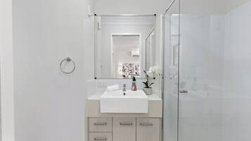 Shower, towels, soap, toilet paper
