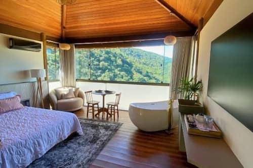 Chalé luxo, 1 cama Queen, para não fumantes, vista para o mar | Lençóis italianos Frette, roupas de cama premium, frigobar