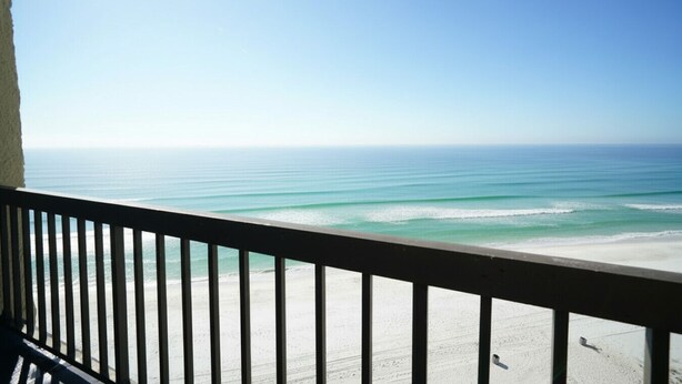 A balcony with a view of the ocean. - Ocean and Lake Views w/ 3 Pools Gym Tennis (Panama City Beach)