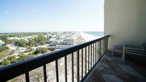 A balcony with a view of a beach and a residential area. - Ocean and Lake Views w/ 3 Pools Gym Tennis (Panama City Beach)