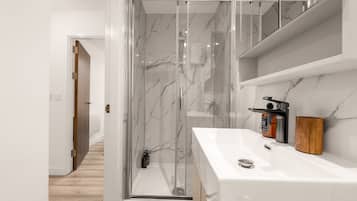 Shower, hair dryer, towels, soap
