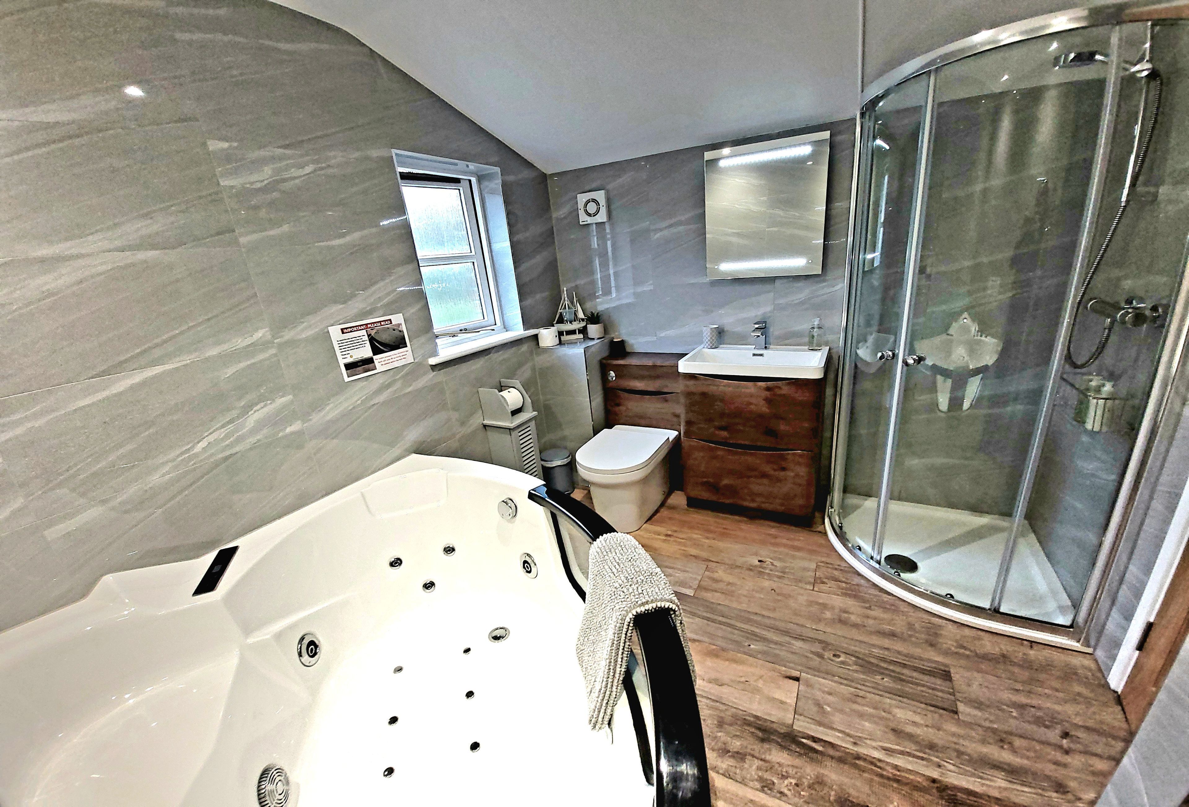 Shower, jetted bath, hair dryer, towels