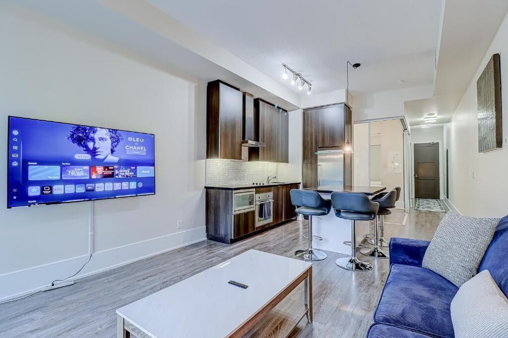 Luxe suite, 1 slaapkamer, balkon, uitzicht op de stad | Woonruimte