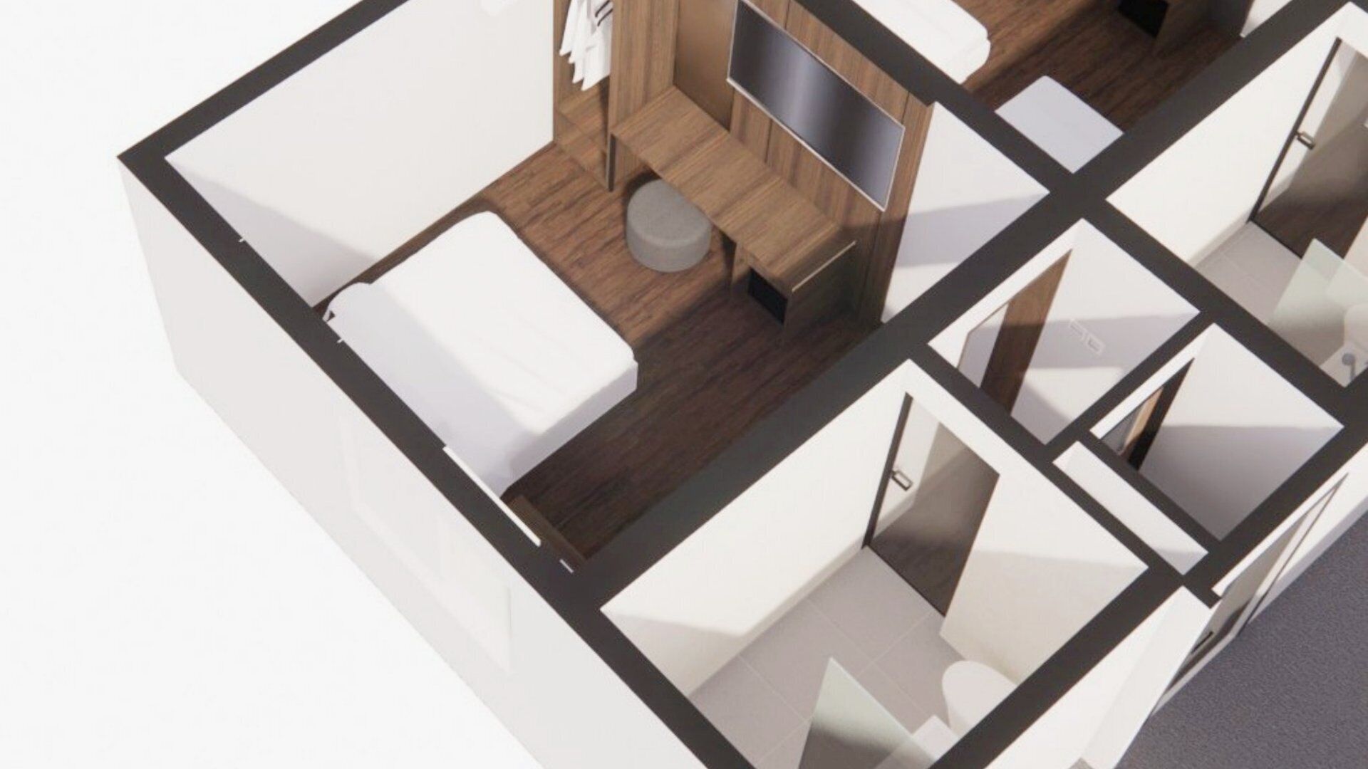 A modern hotel room with a bed, a small seating area, a TV, and a bathroom.