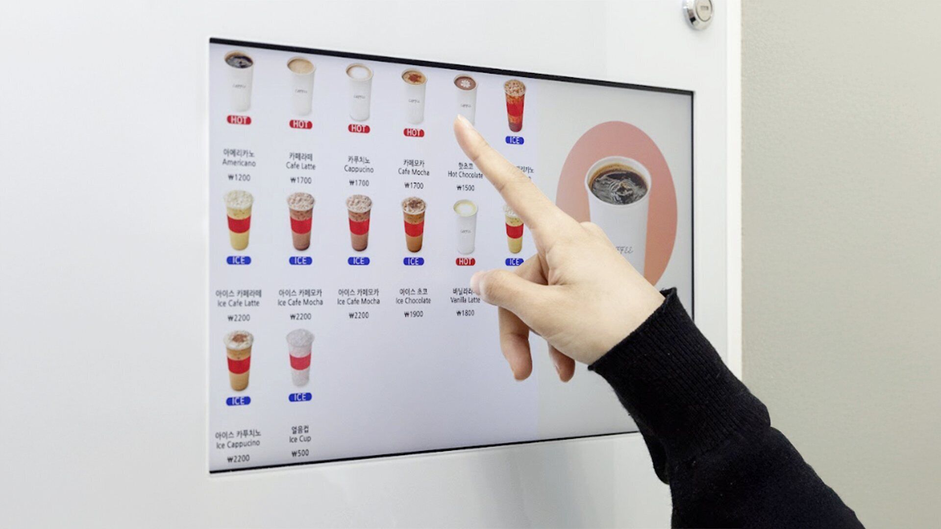 A menu board with various coffee and ice drinks, each labeled with a price.