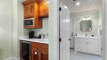 A kitchen with wooden cabinets, a microwave, and a dishwasher.