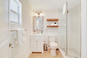 Shower, hair dryer, towels, shampoo