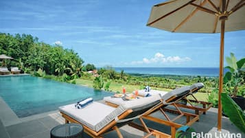 2 outdoor pools, pool umbrellas, pool loungers