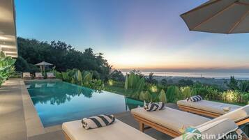 2 outdoor pools, pool umbrellas, pool loungers