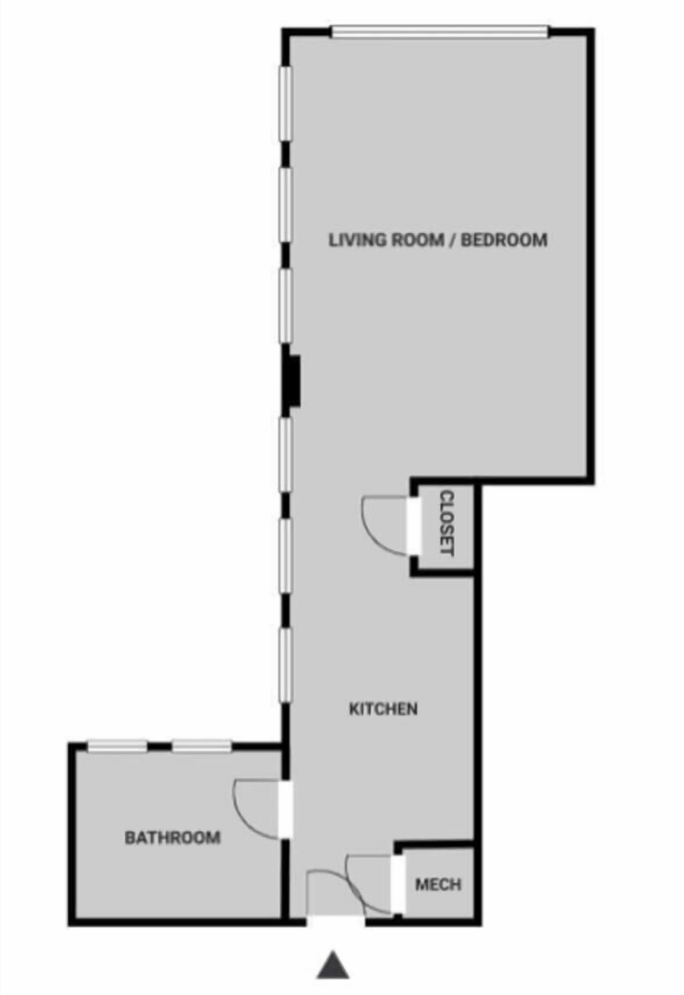 A floor plan with a living room/bedroom, kitchen, bathroom, closet, and mechanical room.