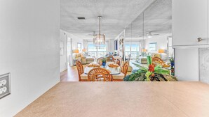 A spacious dining area with a high ceiling and modern lighting. - Gulf to Bay Island Oasis (Bradenton Beach)