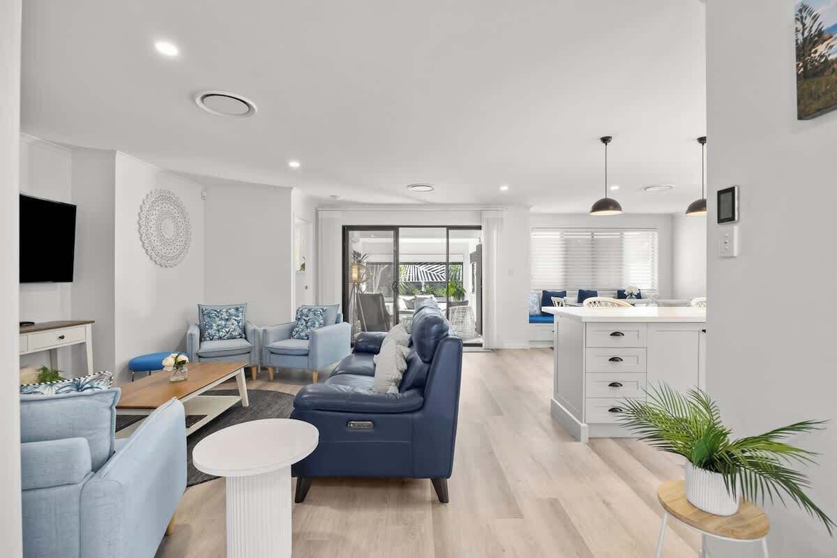 The open-plan living area includes plenty of comfy seating to settle in with a movie, while central air-conditioning provides comfort year-round. 
