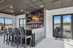 Bar (on property) - Lakefront resort home. Sleeps 26+! Boat dock, kayaks, pool, hot tub & more! (Graham)