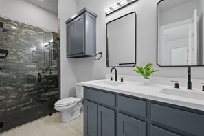 Shower, hair dryer, towels, soap - Lakefront resort home. Sleeps 26+! Boat dock, kayaks, pool, hot tub & more! (Graham)
