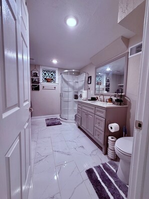 Shower, hair dryer, towels, soap