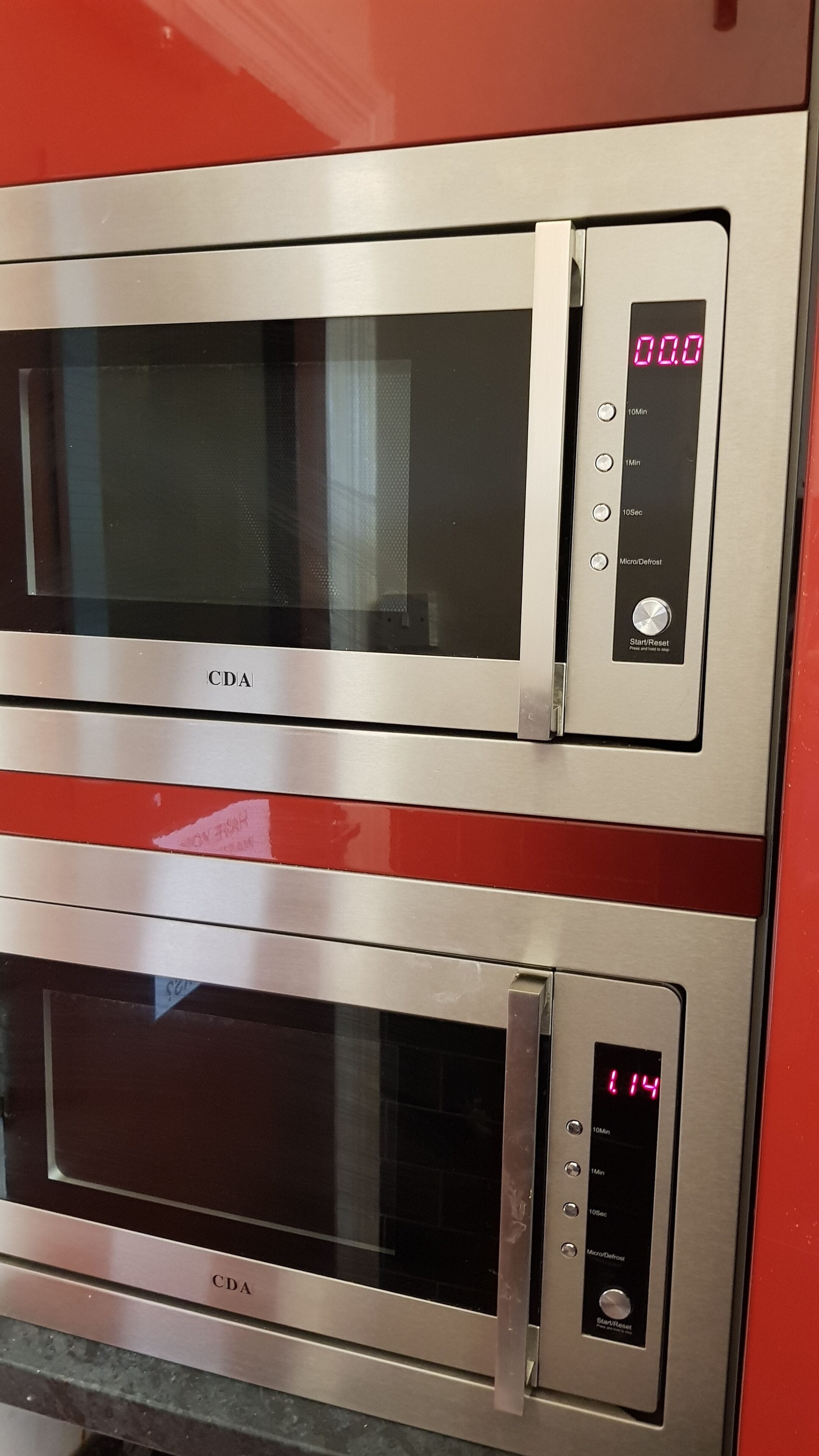Two stainless steel CDA ovens with digital displays, one showing 00.0 and the other 114.