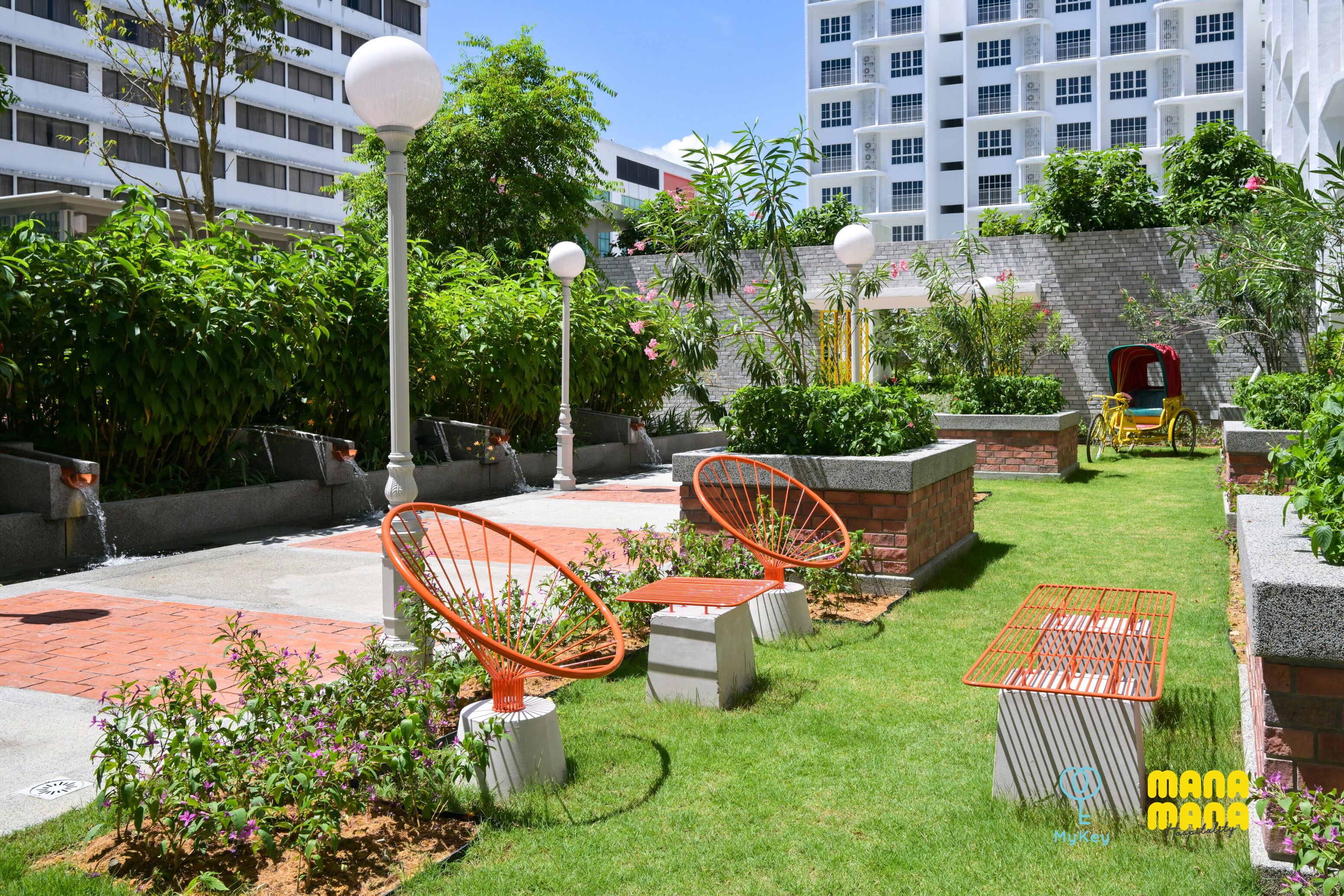 A courtyard with outdoor seating, a water feature, and a red carriage.
