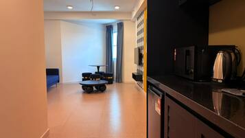 Suite Deluxe | Tabla de planchar con plancha y wifi gratis