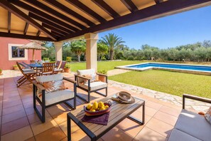 An outdoor patio with a pool, seating area, and a view of the pool. - El Cel, cozy villa with pool and mountain views 5 min from the beach! (POLLENSA)