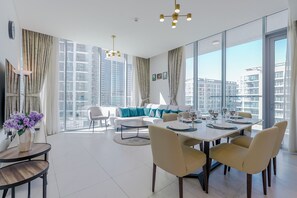 Deluxe Apartment, Balcony, Lagoon View | Living area | 55-inch Smart TV with digital channels - District One Residences - MBR  (Dubai)