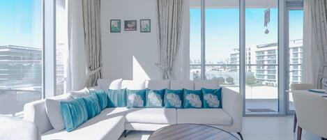 Deluxe Apartment, Balcony, Lagoon View | Living area | 55-inch Smart TV with digital channels