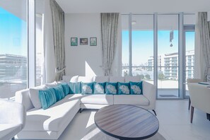 Deluxe Apartment, Balcony, Lagoon View | Living area | 55-inch Smart TV with digital channels - District One Residences - MBR  (Dubai)