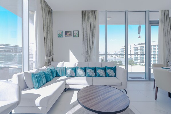 Deluxe Apartment, Balcony, Lagoon View | Living area | 55-inch Smart TV with digital channels - District One Residences - MBR  (Dubai)