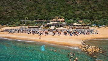 On the beach, sun loungers, beach towels