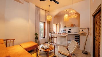 Luxury Apartment, Garden View | Living area | 40-inch LED TV with digital channels