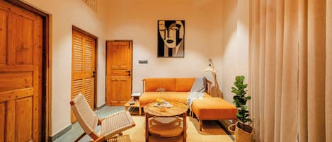 Luxury Apartment, Garden View | Living area | 40-inch LED TV with digital channels