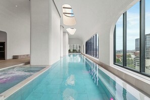 Indoor pool - Designer 1BR + Sofa Bed in Aspire | Skyline Views (Melbourne)