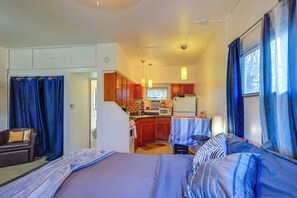 A compact hotel room with a bed, a small kitchenette, a sofa, and a dining area. - 5 Mi to Coors Field & Lodo: North Denver Studio (Denver)