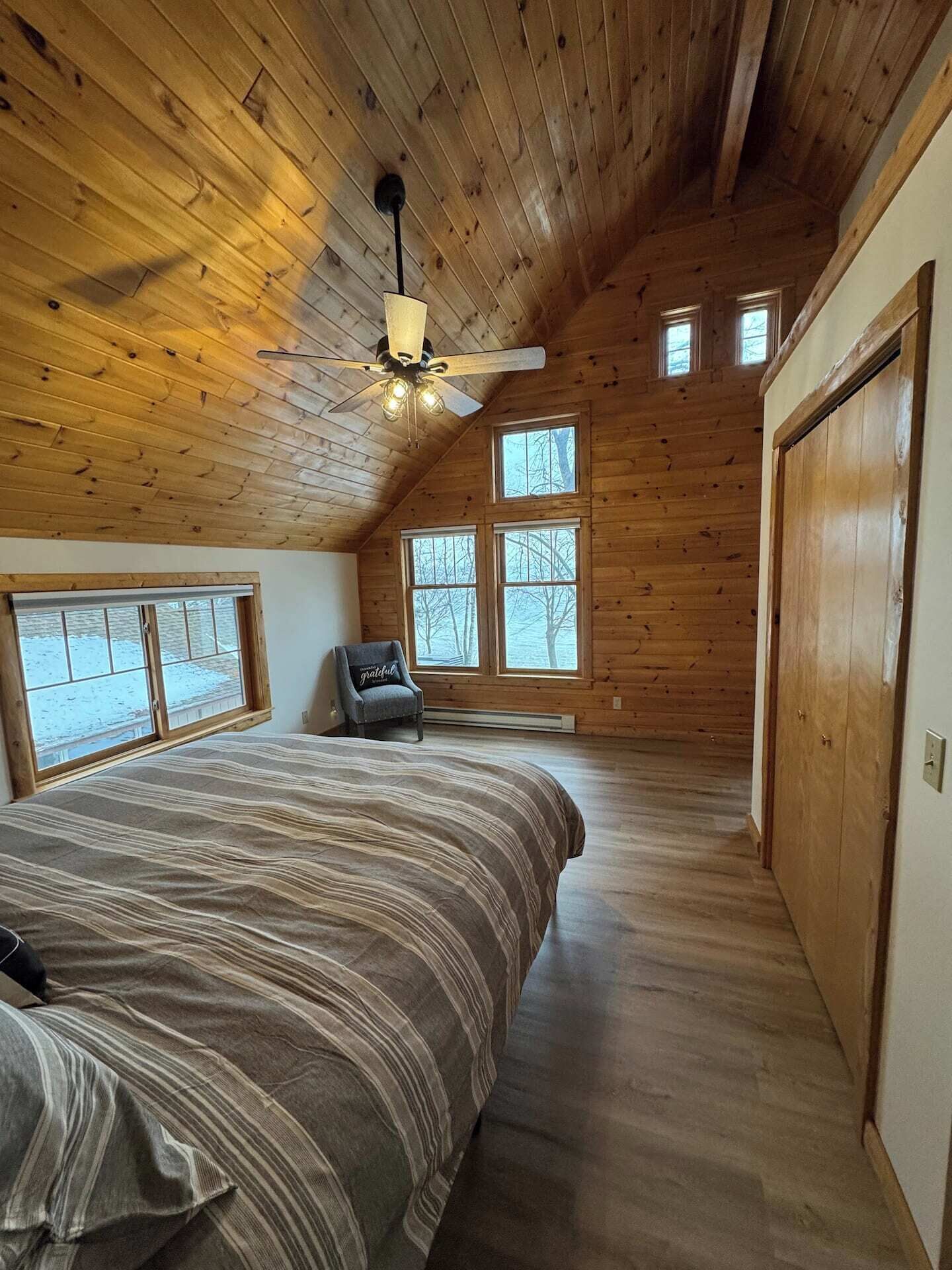 King Master bedroom on upper level with breathtaking views of the lake!