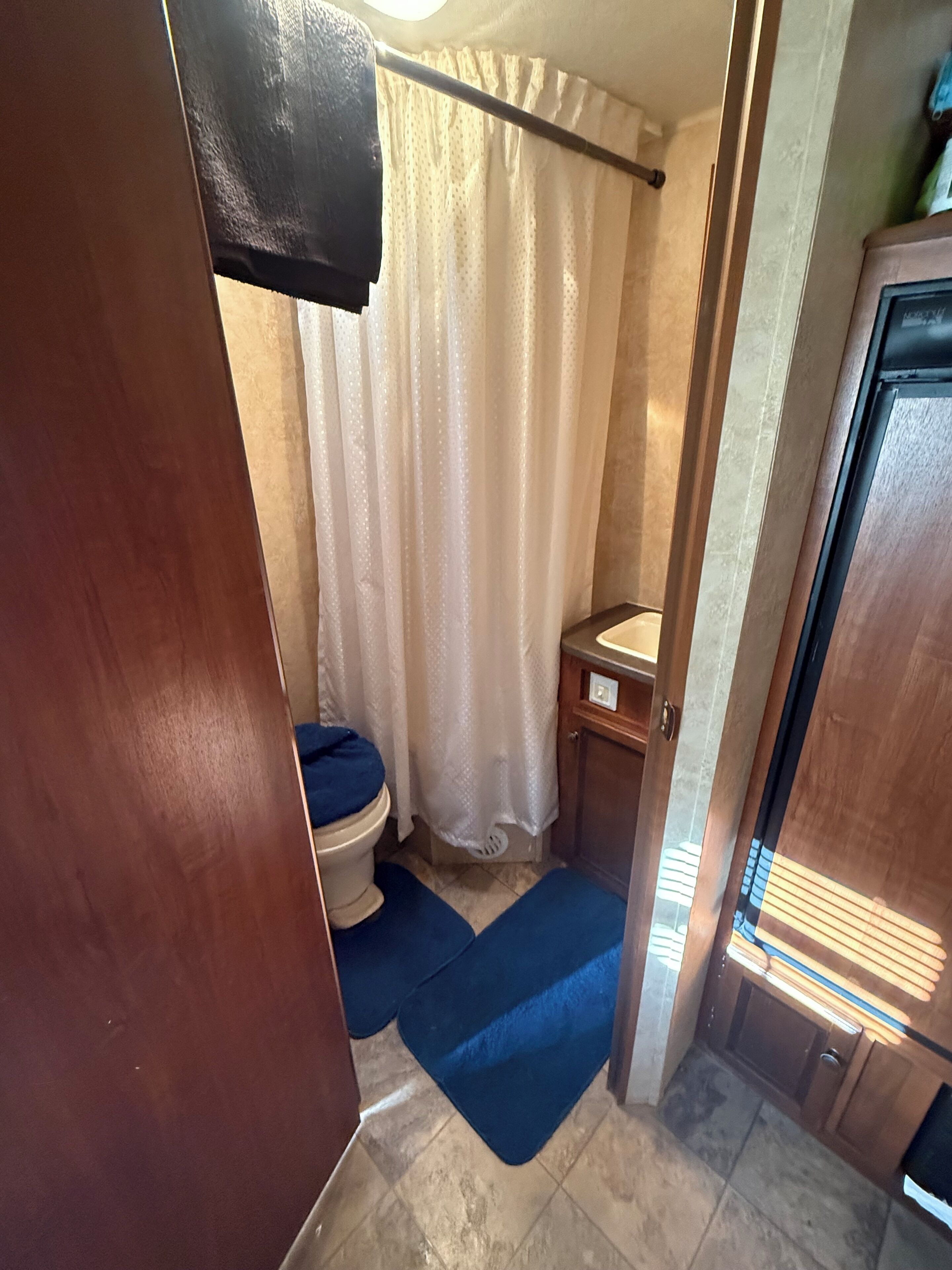 Shower, towels, soap, toilet paper