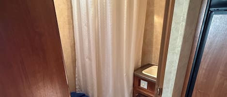 Shower, towels, soap, toilet paper