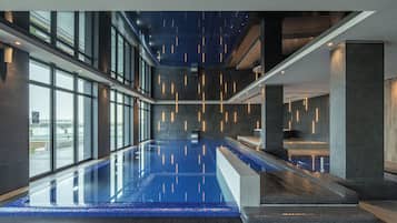 Indoor pool, open 9:00 AM to 10:00 PM, pool loungers